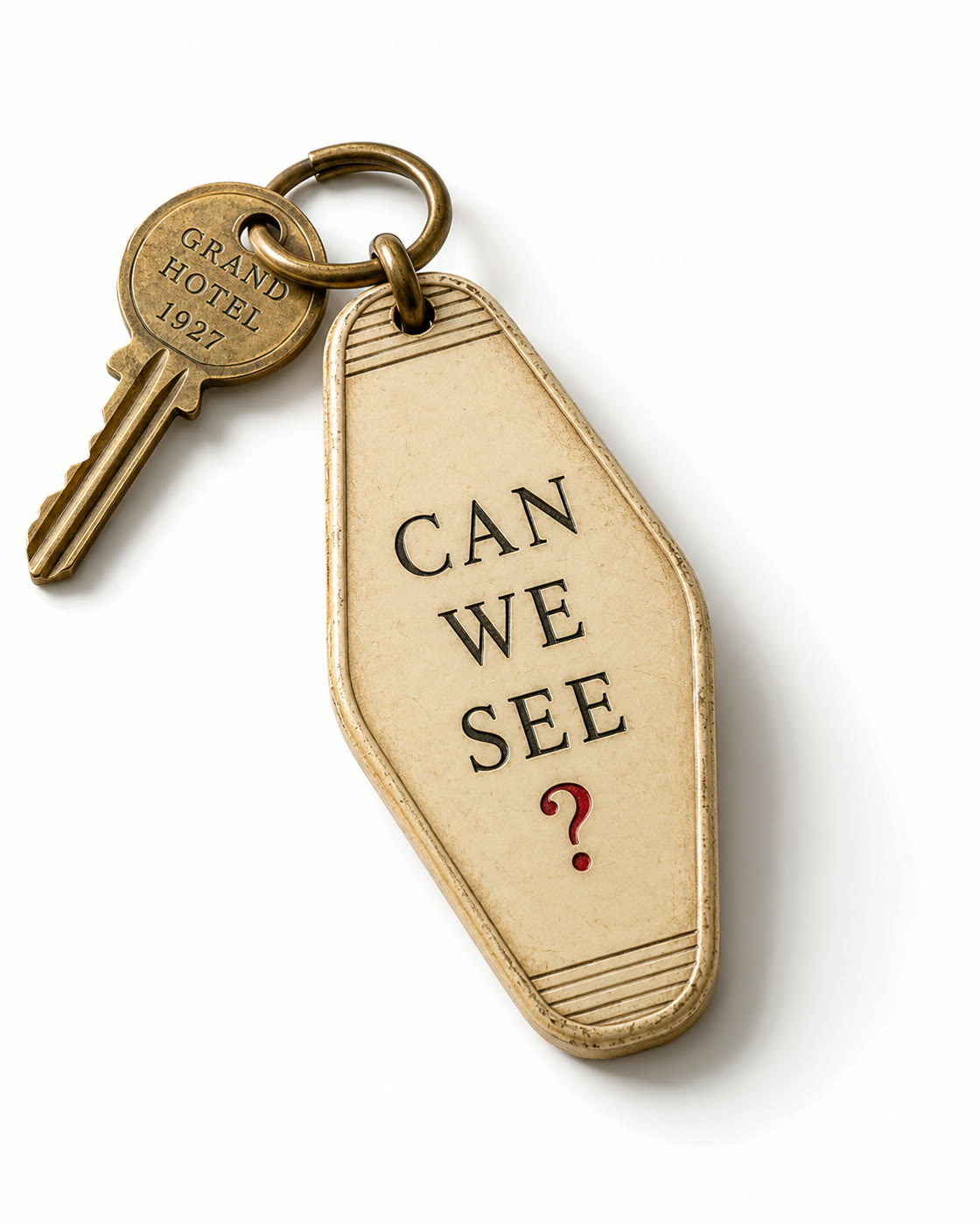 A brass hotel key with a can we see fob