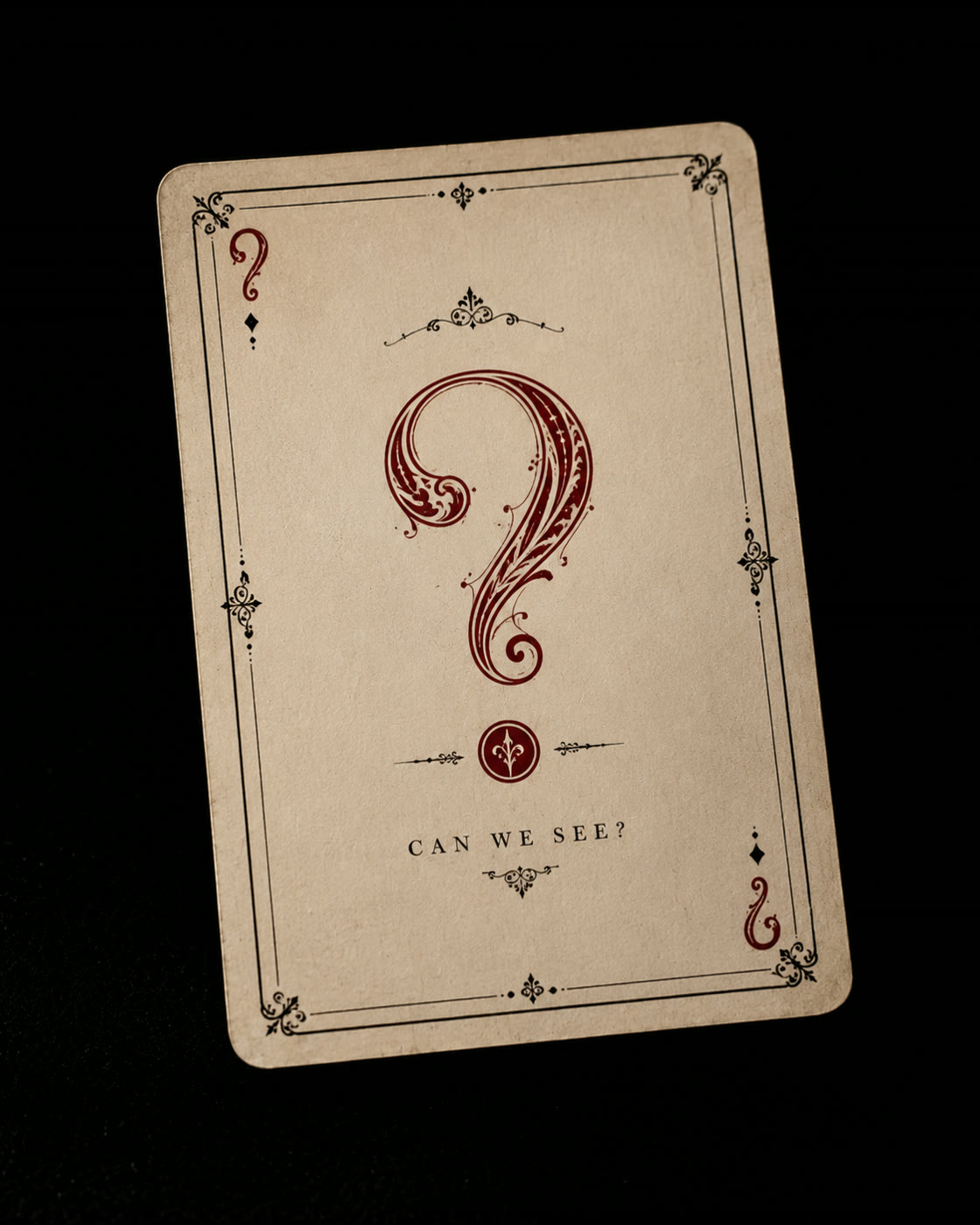 A tarot-style card with an ornate red question mark