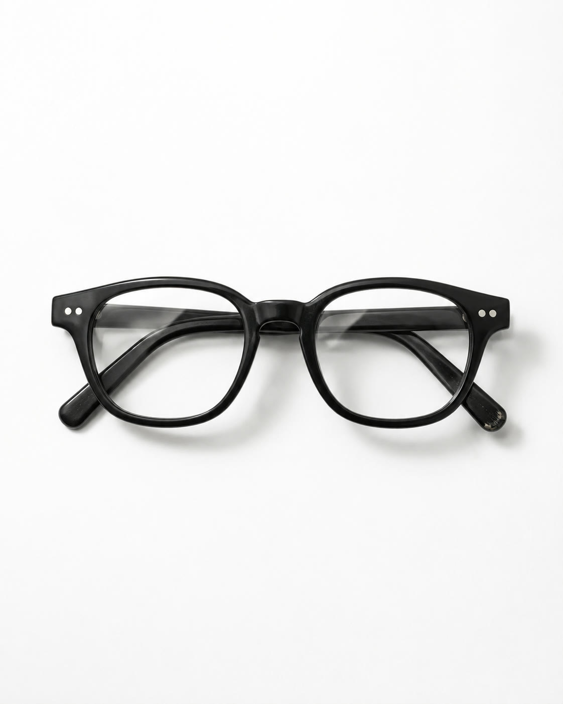 Black reading glasses on white