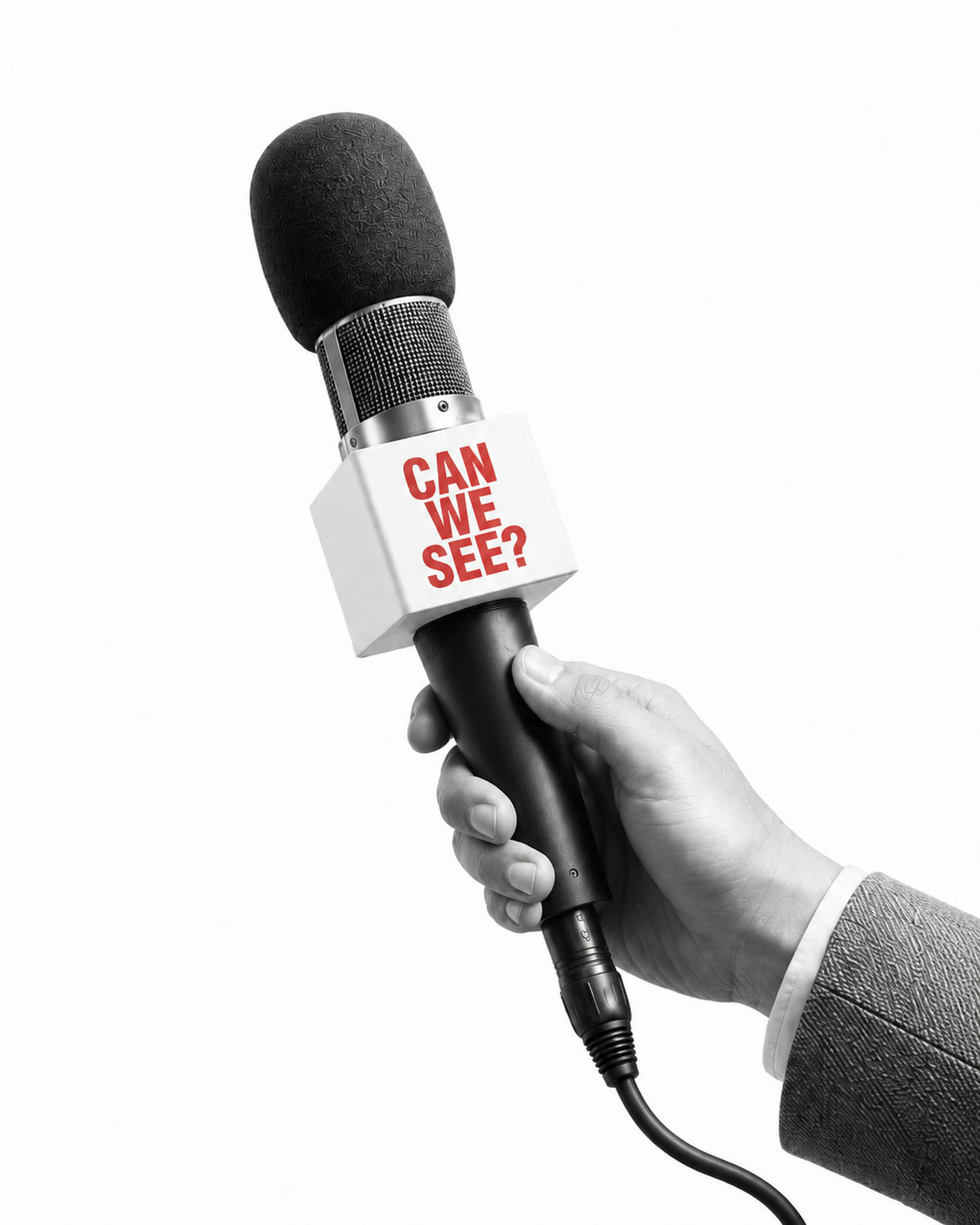 A studio microphone held in a hand